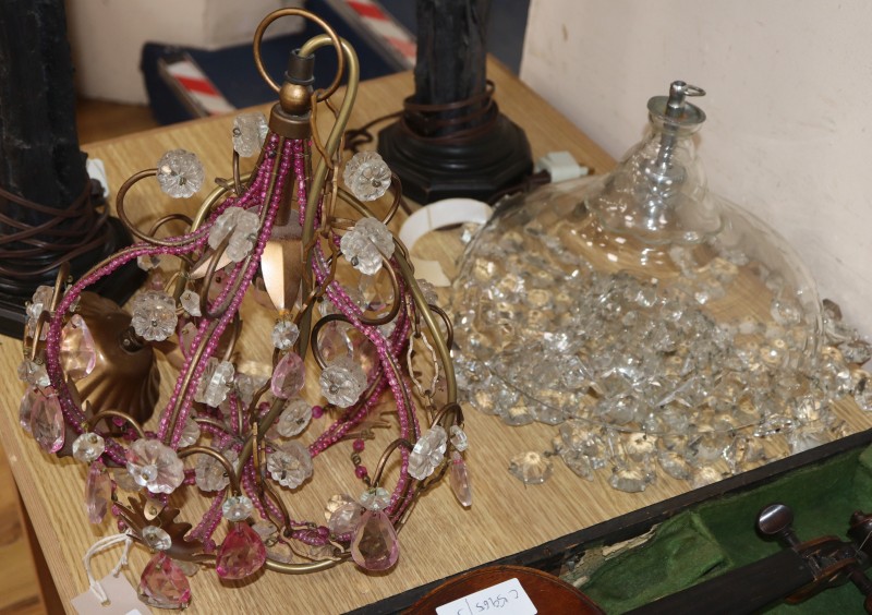 A Venetian-style ceiling light and a glass bag-shaped light